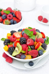 bowl of fresh fruit salad and berries