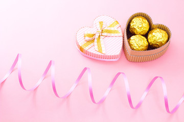 Chocolates in a heart gift box with ribbon