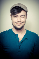 young modern stylish man with cap