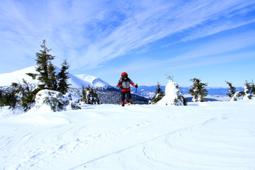 Winter hiking in the mountains on snowshoes.