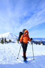 Fototapeta na wymiar Winter hiking in the mountains on snowshoes.