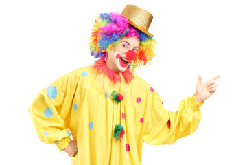 A cheerful clown in a yellow costume