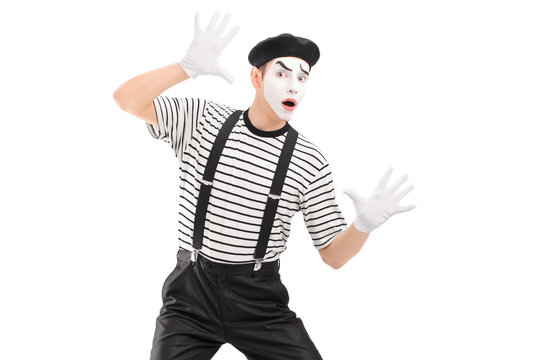 A male mime artist performing