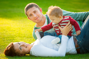 Fototapeta na wymiar Family playing on grass
