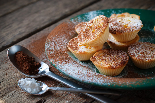 Lemon Tartlets decorated with Powdered sugar and cocoa