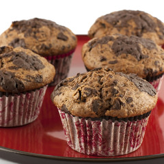 chocolate muffins on a red plate