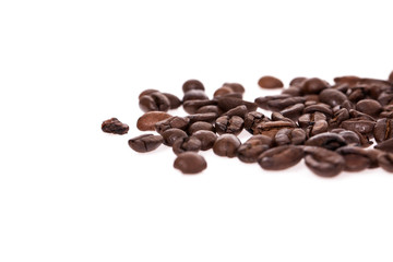 Scattered coffee beans isolated on white