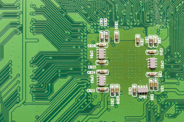 Green Electrical Circuit Board with microchips and transistors