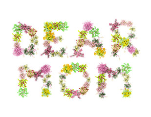 words DEAR MOM spelled  out with flowers