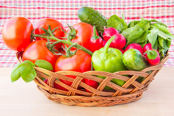 Fresh spring vegetables for salad in basket