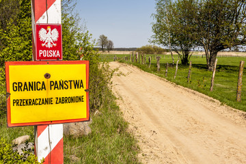 Border post with the emblem of the Poland.