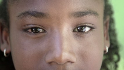 Portrait of happy young black girl looking at camera, smiling