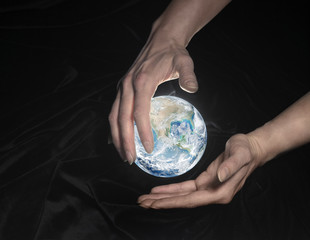 crystal globe and hands