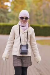 portrait of caucasian girl walking in park