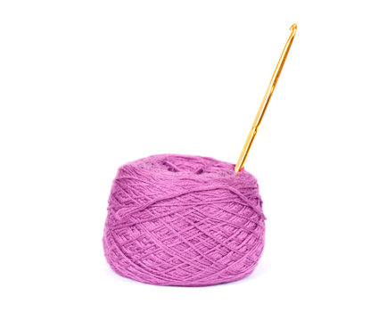 yarn color purple ball with crochet on white background
