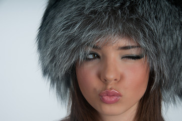Young woman in a fur hat