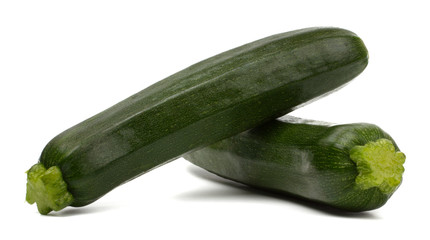 Two fresh vegetable zucchini isolated on white background