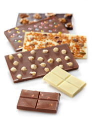 Various chocolate bars on white background