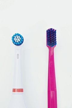 toothbrush with electrical toothbrush on a white background