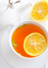 Fresh tea with lemon in the white cup