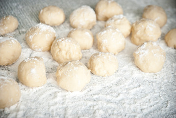 Fototapeta na wymiar Prepared dough in ball shape on silver tray