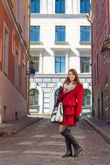 Fototapeta na wymiar attractive woman walking in old town of Tallinn