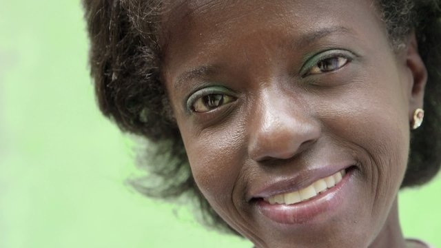 Portrait of happy mature black woman looking at camera