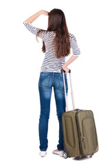 Back view of brunette woman with suitcase looking up © ghoststone