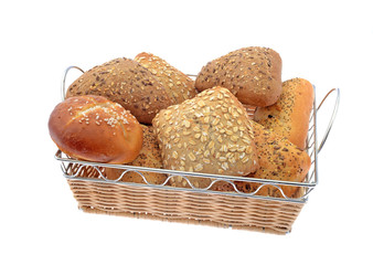 whole grain and white rolls in basket isolated on white