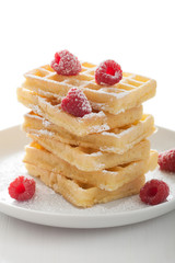 waffle with raspberry and icing sugar