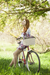 Fototapeta na wymiar Girl on a bike in the countryside