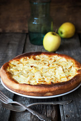 Open Apple Pie filled in with a mix from eggs and sour cream
