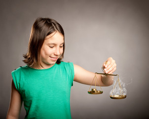 young girl holding a justice scale with money and smoke