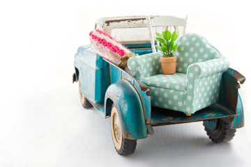 Toy truck packed with furniture for moving