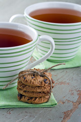 Two cups of tea and cookies