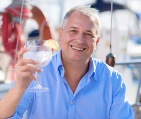 Mature Man enjoying fresh lemonade