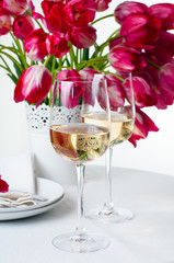 Two glasses of white wine on a table