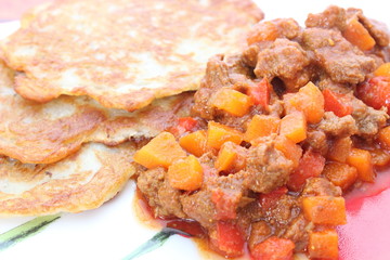 Hungarian goulash and potato pancakes