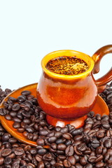 Cup of hot coffee with coffee grains