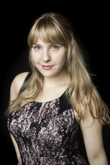 Young Woman with Beautiful Blue Eyes on Black Background