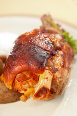 roasted pork knuckle with potatoes
