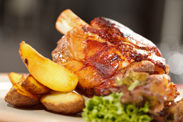 roasted pork knuckle with potatoes