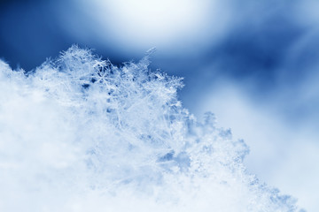 Snowflake in blue snow
