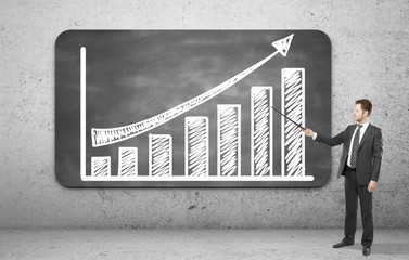 man pointing on a graph