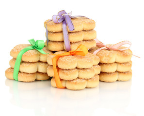 Fototapeta na wymiar Sweet cookies tied with colorful ribbons isolated on white
