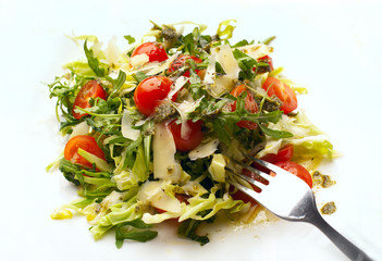 Italian salad with cherry, basilic, rucola, pesto and parmigiano