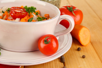 Delicious rice with vegetables and herbs in pot