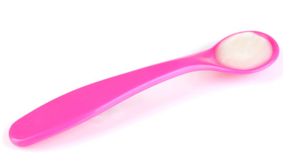 Pink spoon for baby food isolated on white