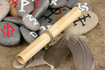 Fortune telling  with symbols on stones on burlap background
