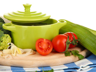 Diet soup with vegetables in pan isolated on white